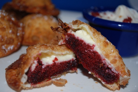 Red velvet cake, cheesecake filling in a wonton with cream cheese icing for dipping!